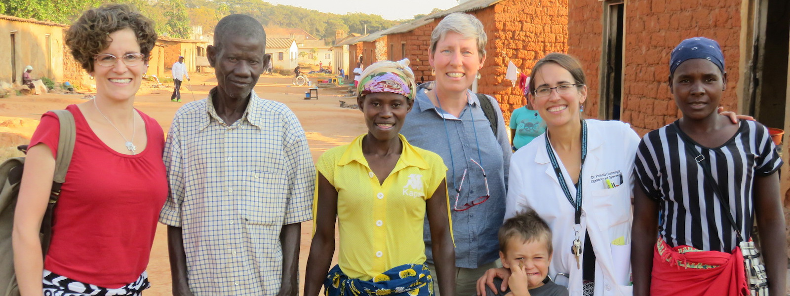 Hope for Our Sisters staff with clients in Angolan village