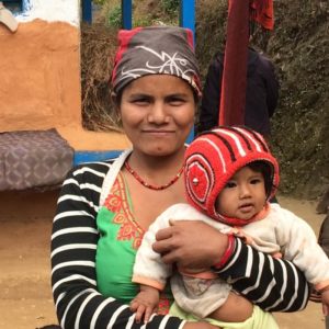 Nepalese woman holding her baby