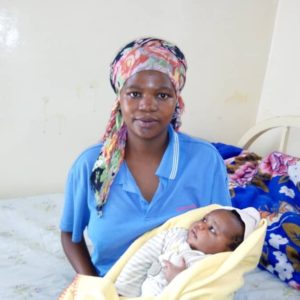 Congolese woman holding her baby