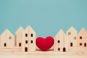 Wooden toy houses with crocheted heart