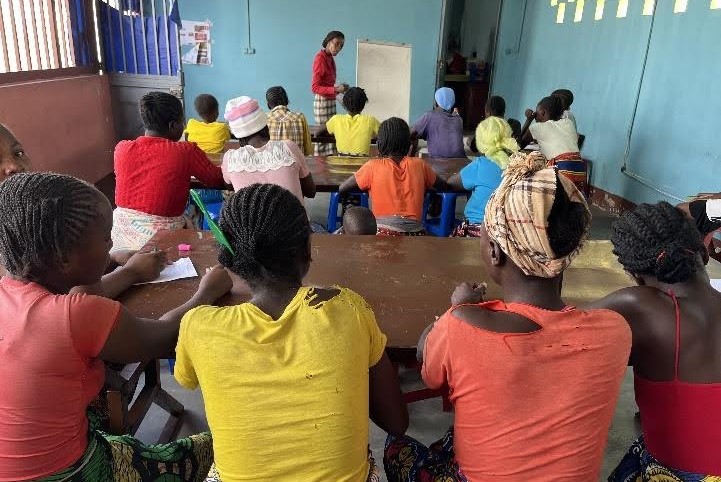 Classroom of Angolan women being taught literacy skills