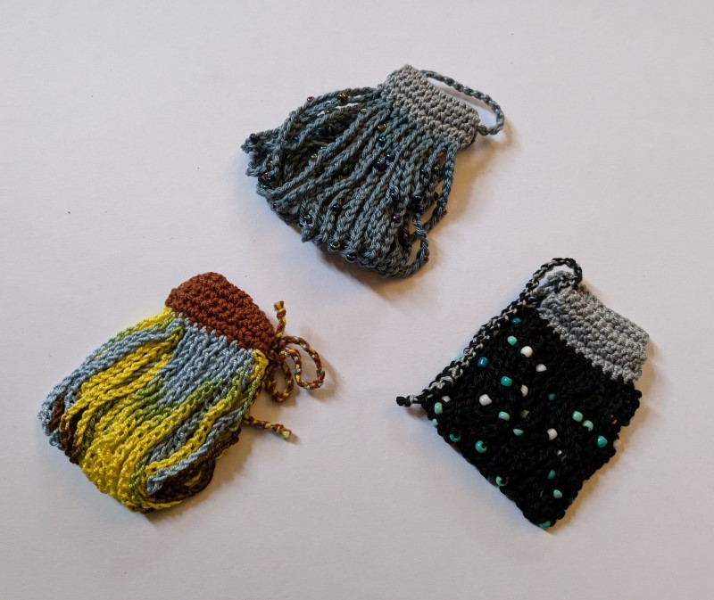 Cuff-style bracelets with crocheted strands